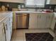 Kitchen boasts stainless steel dishwasher and white cabinetry at 7820 Foxwood Pl, Las Vegas, NV 89145