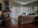 Living room features a fireplace and wood flooring at 7820 Foxwood Pl, Las Vegas, NV 89145