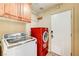 Laundry room with washer, dryer, and cabinets at 7969 Gorgas Ct, Las Vegas, NV 89129