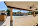 Covered patio with pool and built-in grill at 7969 Gorgas Ct, Las Vegas, NV 89129