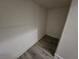 Small closet with wood-look flooring at 8309 Cherry Glaze Ave # 201, Las Vegas, NV 89145