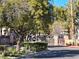 Gated entrance to Ironwood Condominiums community with lush landscaping at 8309 Cherry Glaze Ave # 201, Las Vegas, NV 89145
