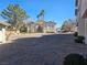 Attractive condo exterior featuring a two-story building with lush landscaping in a well-maintained community at 8309 Cherry Glaze Ave # 201, Las Vegas, NV 89145