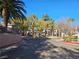 Palm tree-lined entrance to Ironwood Condominiums community at 8309 Cherry Glaze Ave # 201, Las Vegas, NV 89145