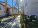 Landscaped walkway between two-story townhouses at 8309 Cherry Glaze Ave # 201, Las Vegas, NV 89145