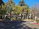 Attractive condo with desert landscaping, mature palms, and paved entry at 8309 Cherry Glaze Ave # 201, Las Vegas, NV 89145