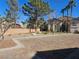 Attractive condo exterior featuring a two-story building with lush landscaping in a well-maintained community at 8309 Cherry Glaze Ave # 201, Las Vegas, NV 89145