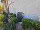 Exterior shot of the air conditioning unit surrounded by green landscaping at 8309 Cherry Glaze Ave # 201, Las Vegas, NV 89145