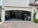 Attached two car garage featuring brick driveway and ample storage at 8309 Cherry Glaze Ave # 201, Las Vegas, NV 89145