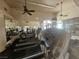 Community fitness center with treadmills, weights, and mirrored walls for a comprehensive workout space at 8309 Cherry Glaze Ave # 201, Las Vegas, NV 89145