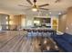 Open concept kitchen and living area with hardwood floors and island at 8309 Cherry Glaze Ave # 201, Las Vegas, NV 89145