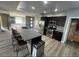 Stylish kitchen with stainless steel appliances, sleek countertops and a spacious island with barstool seating at 8309 Cherry Glaze Ave # 201, Las Vegas, NV 89145