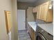 Laundry room with washer, dryer, and cabinets at 8309 Cherry Glaze Ave # 201, Las Vegas, NV 89145