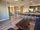 Spacious living area with hardwood floors and a view of the kitchen and upper level at 8309 Cherry Glaze Ave # 201, Las Vegas, NV 89145