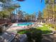 Community pool with lounge chairs and landscaping at 8309 Cherry Glaze Ave # 201, Las Vegas, NV 89145