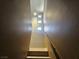 Bright staircase with light-colored wood and small windows at 8309 Cherry Glaze Ave # 201, Las Vegas, NV 89145