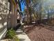 Pathway beside an apartment building with palm trees and shrubs at 8309 Cherry Glaze Ave # 201, Las Vegas, NV 89145