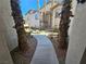 Walkway leading to apartment building with lush landscaping and palm trees at 8309 Cherry Glaze Ave # 201, Las Vegas, NV 89145