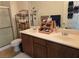 Bathroom featuring a double sink vanity with dark wood cabinets at 8985 S Durango Dr # 2062, Las Vegas, NV 89113