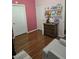 Bedroom showcasing wood floors and a collection of colorful books at 8985 S Durango Dr # 2062, Las Vegas, NV 89113