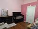 Bedroom with wood floors and a dark wood crib and dresser at 8985 S Durango Dr # 2062, Las Vegas, NV 89113