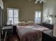 Bedroom featuring plantation shutters and hardwood flooring at 8985 S Durango Dr # 2062, Las Vegas, NV 89113