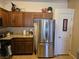 Modern kitchen with stainless steel refrigerator and granite counters at 8985 S Durango Dr # 2062, Las Vegas, NV 89113