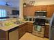 Well-lit kitchen with stainless steel appliances, tile floors, and granite countertops at 8985 S Durango Dr # 2062, Las Vegas, NV 89113