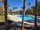 Outdoor pool area showcasing lounge chairs, landscaping and inviting community amenities at 8985 S Durango Dr # 2062, Las Vegas, NV 89113