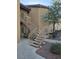 Exterior view of a staircase with manicured landscaping providing access to upper units at 8985 S Durango Dr # 2062, Las Vegas, NV 89113