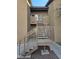 Exterior staircase with elegant railing provides access to upper-level units in community at 8985 S Durango Dr # 2062, Las Vegas, NV 89113