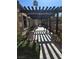 Shaded walkway featuring well-maintained landscaping and elegant architectural details at 8985 S Durango Dr # 2062, Las Vegas, NV 89113