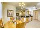 Dining area with wood table, chairs, and view into living area and kitchen at 9050 W Warm Springs Rd # 1022, Las Vegas, NV 89148