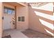 Welcoming front entrance with an decorative door featuring sidelight windows plus stucco wall and textured surface at 9621 Blue Bell Dr, Las Vegas, NV 89134