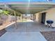 Covered patio, perfect for outdoor entertaining, overlooks grassy area at 1009 Winwood St, Las Vegas, NV 89108