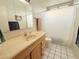 Clean bathroom, featuring a shower/tub combo and updated vanity at 1009 Winwood St, Las Vegas, NV 89108