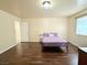 Cozy bedroom with a double bed and dark wood flooring at 1009 Winwood St, Las Vegas, NV 89108