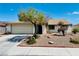 Single-story home with a landscaped yard and attached garage at 1009 Winwood St, Las Vegas, NV 89108