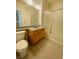 Well-lit bathroom with shower/tub combo and wood-look flooring at 10290 Gilmore Canyon Ct # 103, Las Vegas, NV 89129