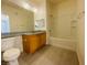 Clean bathroom with tub, vanity, and updated flooring at 10290 Gilmore Canyon Ct # 103, Las Vegas, NV 89129
