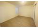 Simple bedroom with light walls, wood-look flooring, and a large closet at 10290 Gilmore Canyon Ct # 103, Las Vegas, NV 89129