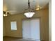 Dining area with light flooring, window, and a ceiling light fixture at 10290 Gilmore Canyon Ct # 103, Las Vegas, NV 89129