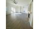 Spacious living room with wood-look flooring and access to a patio at 10290 Gilmore Canyon Ct # 103, Las Vegas, NV 89129