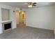 Bright living room featuring a fireplace and laminate flooring at 10290 Gilmore Canyon Ct # 103, Las Vegas, NV 89129