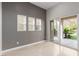 Neutral room showcasing bright natural light from the sliding glass door and windows at 11554 Lampeter Ct, Las Vegas, NV 89138