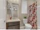 Bathroom featuring a vanity with a dark wood cabinet, white countertops, and a shower with polka dot curtains at 1189 Hillside Peak St, Henderson, NV 89002