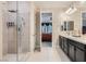 Bright bathroom featuring a glass shower and a double sink vanity with modern fixtures at 1189 Hillside Peak St, Henderson, NV 89002
