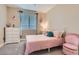 Bedroom features carpet, a ceiling fan and is furnished with a single bed and white dresser at 1189 Hillside Peak St, Henderson, NV 89002