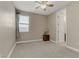 Bedroom with carpet, a ceiling fan and an adjacent bathroom at 1189 Hillside Peak St, Henderson, NV 89002