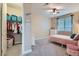 Bright bedroom with closet, neutral walls, ceiling fan, and a large window at 1189 Hillside Peak St, Henderson, NV 89002